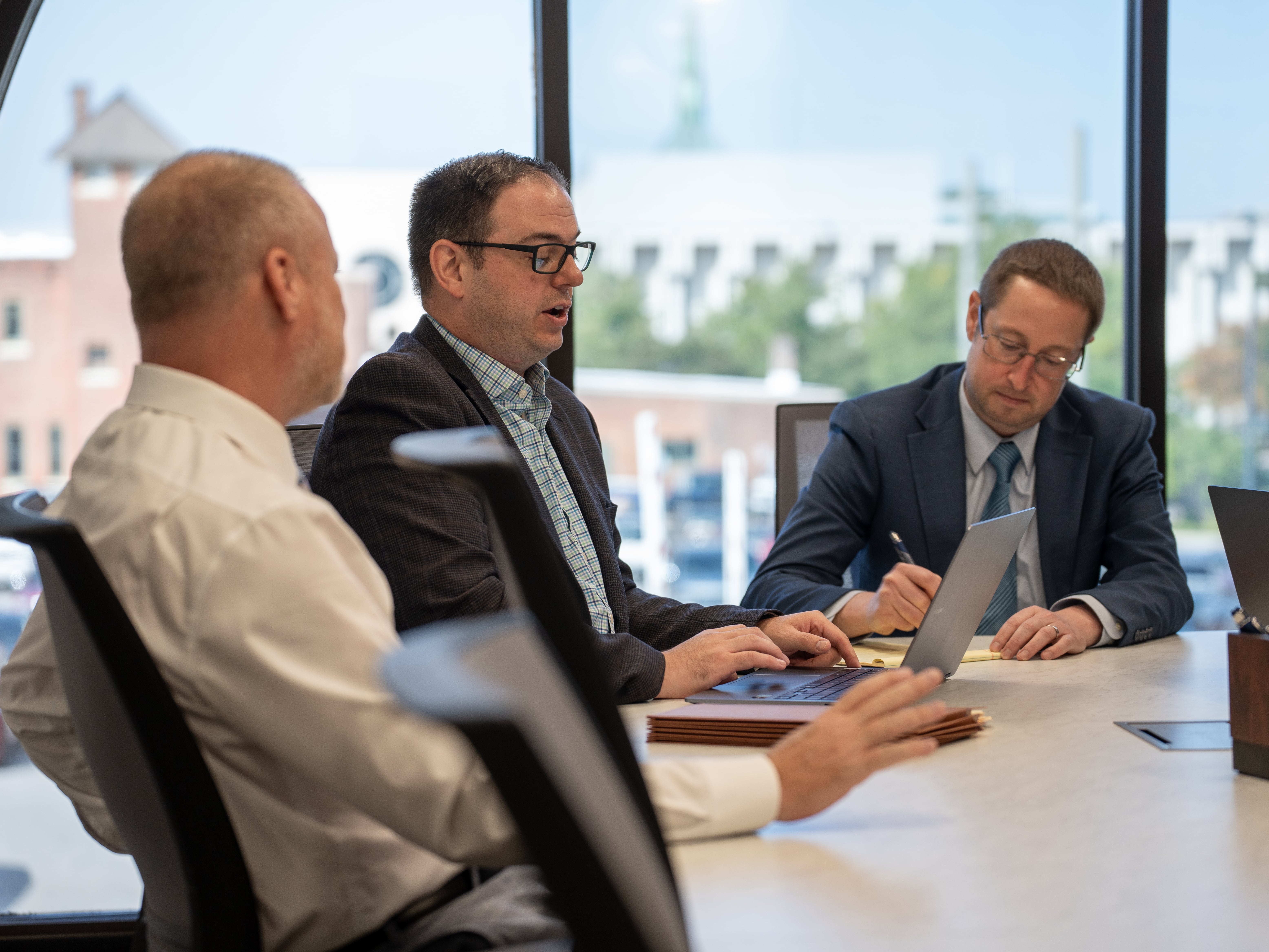 Dan Bobilya, Michael Licari, and Conor Slocum in a Meeting
