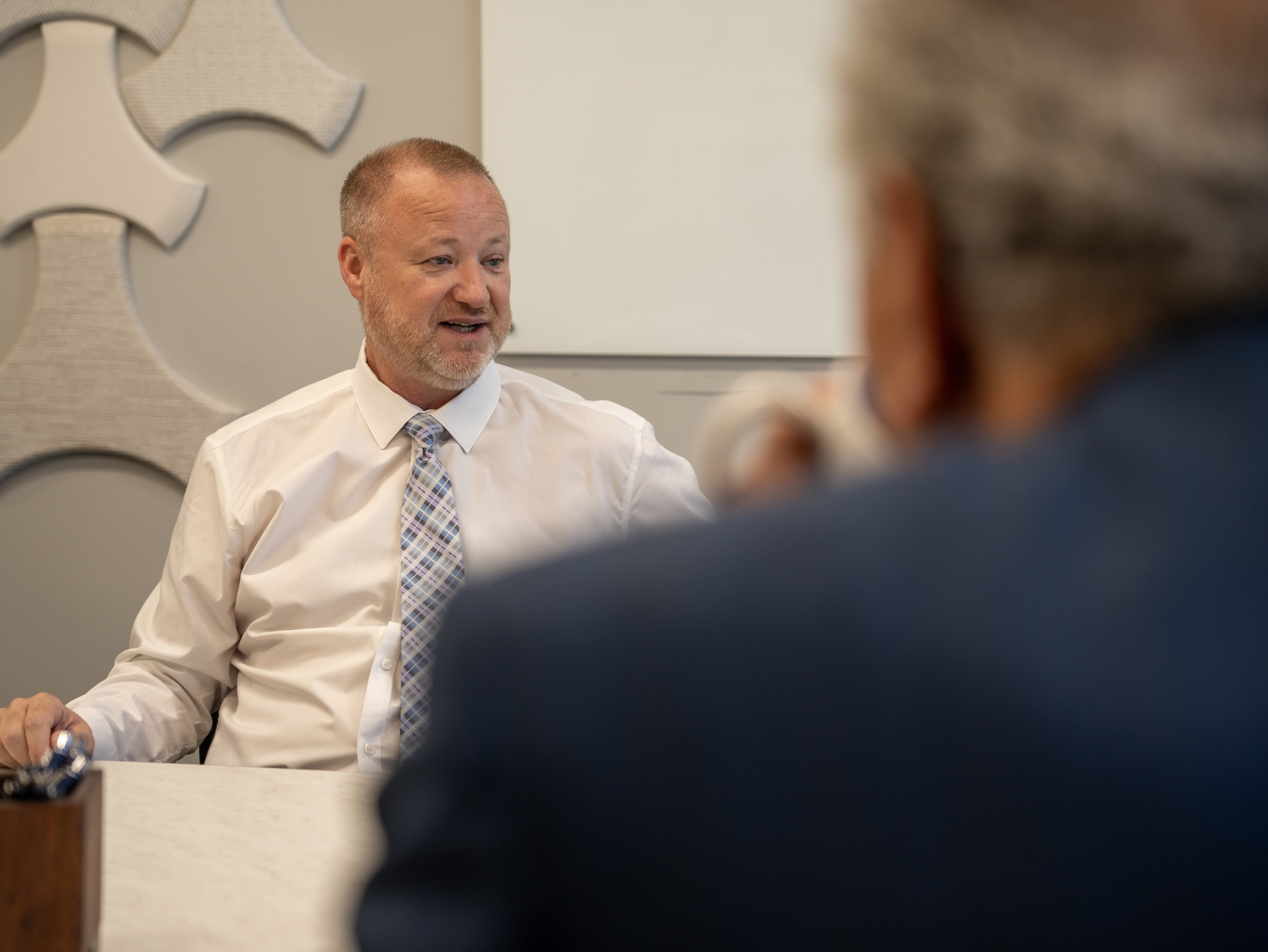 Dan Bobilya Talking with a Client