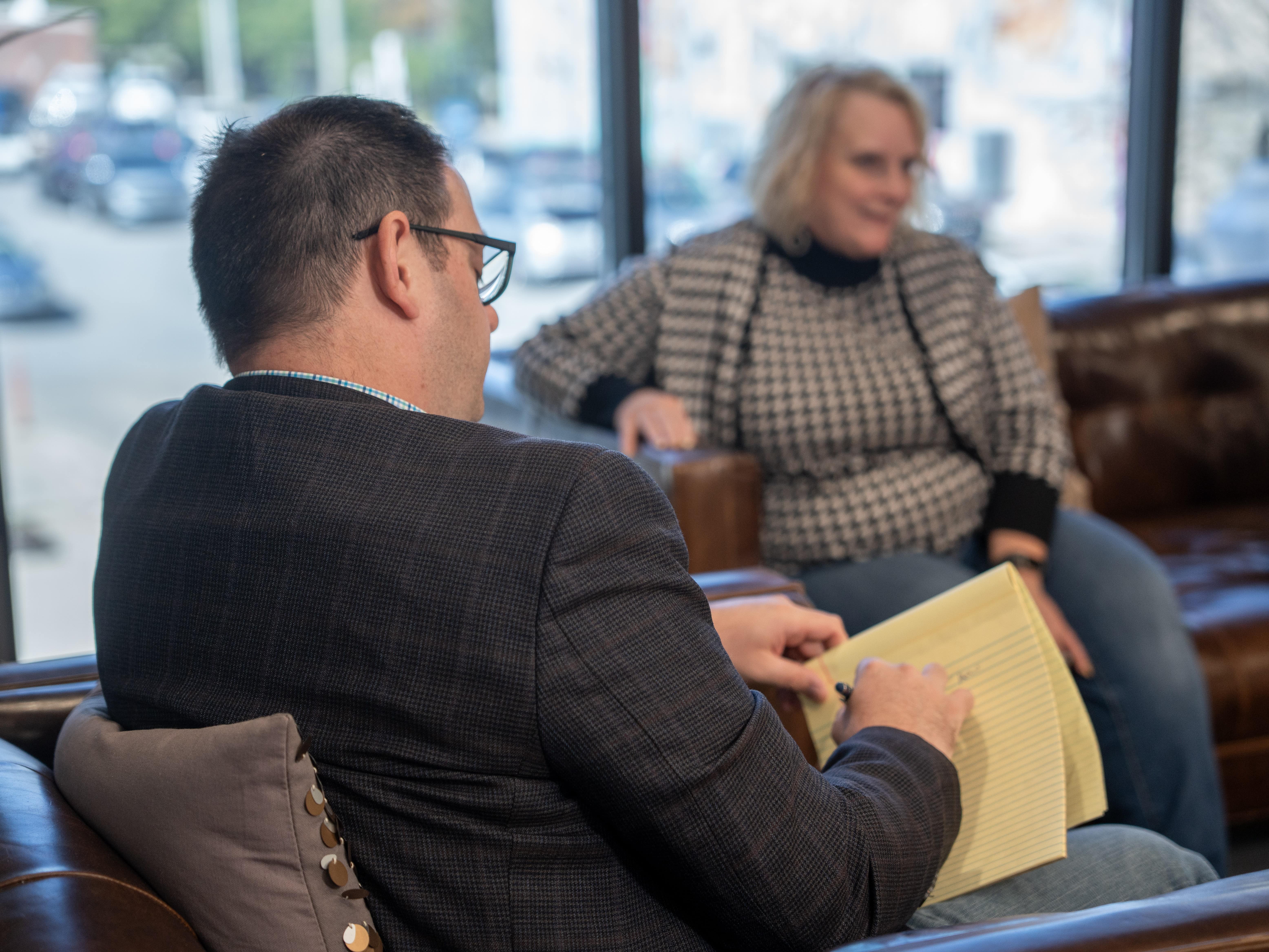 Michael Licari Conversating with a Client